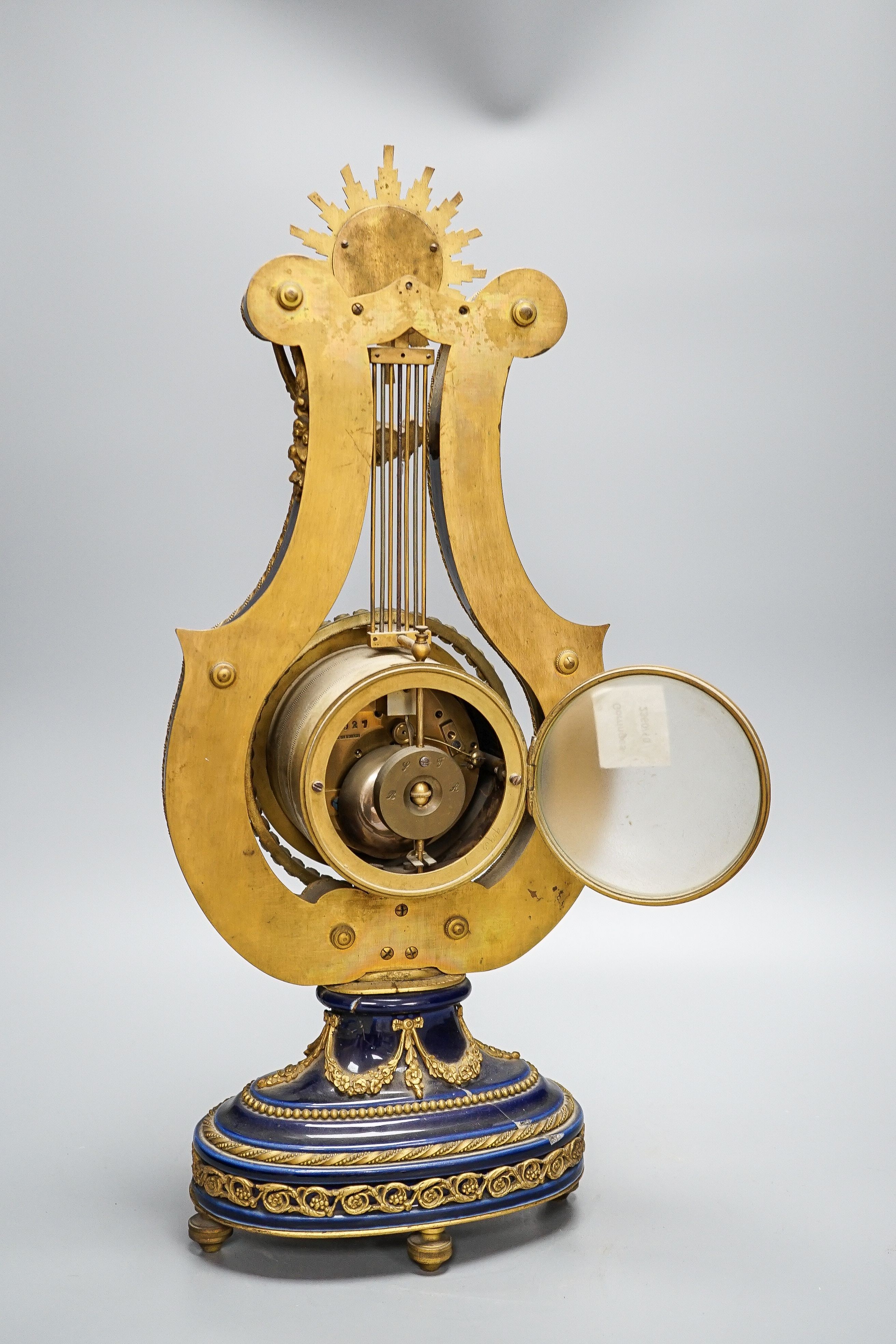 A Louis XV style ormolu mounted blue glazed porcelain lyre-shaped mantel clock (AF) 49cm, paste set surround to the pendulum